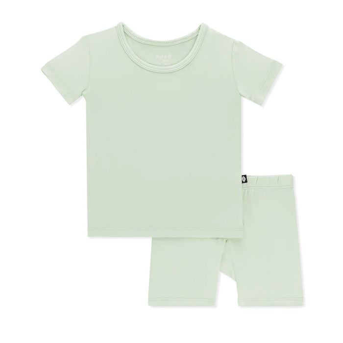 Light green t-shirt and shorts set on a white background