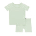 Light green t-shirt and shorts set on a white background
