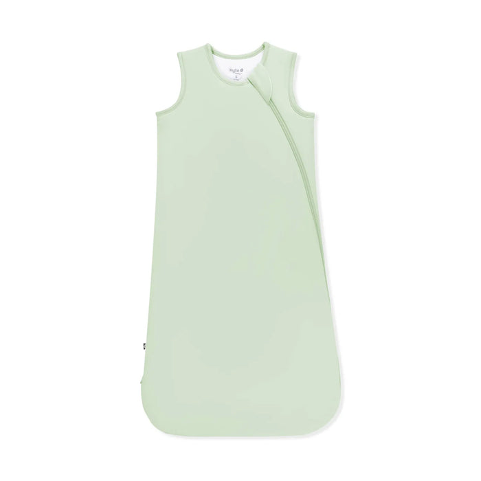 Light green baby sleeping bag on a white background