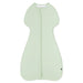 Light green baby sleeping bag with a zipper on a white background