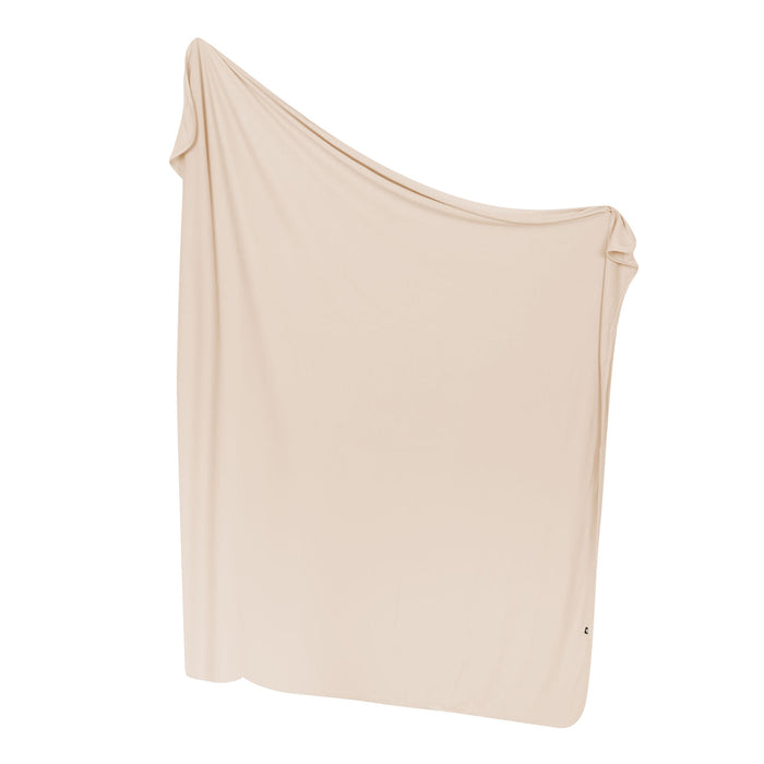 Bisque blanket draped over a white background