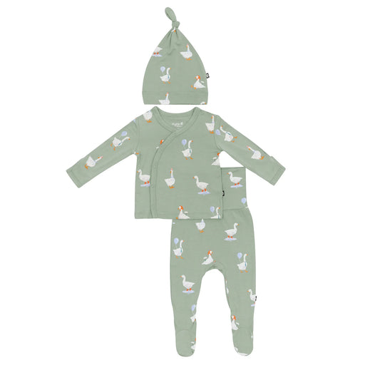 Green newborn baby outfit with goose pattern on a white background