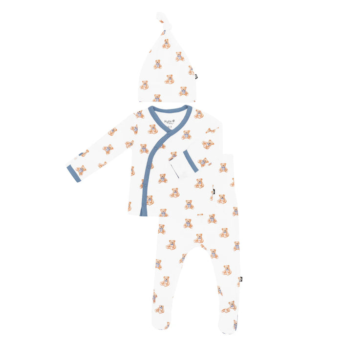 Newborn baby set with teddy bear pattern on a white background