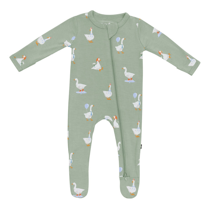 Green baby onesie with long sleeves and footed zippered design with goose pattern on a white background