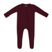 Burgundy baby footed sleeper on a white background