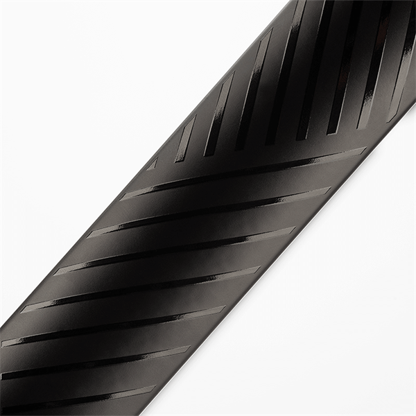Close-up of a black stroller tire with tread pattern on a white background