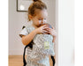 caption-Child holds doll in BabyDoll Carrier 
