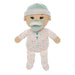 Stuffed toy baby doll with pacifier and polka dot outfit on a white background