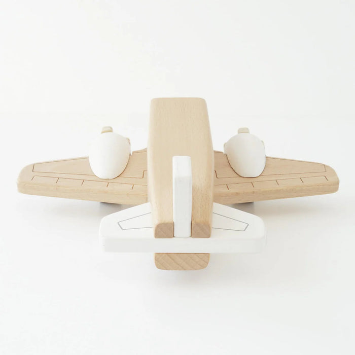 Wooden toy airplane on a white background
