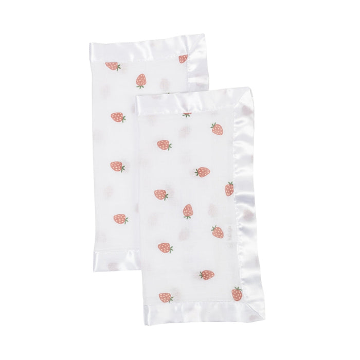 White blanket with strawberry pattern on a white background
