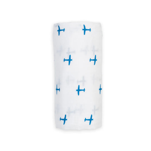 White swaddle blanket with blue airplane pattern on a white background