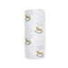 White cotton muslin blanket with rocking horse designs on a white background