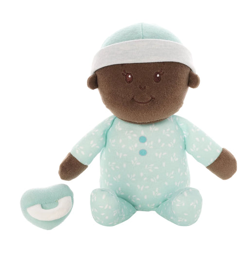 Stuffed toy baby doll with brown skin, wearing a light blue outfit with white patterns on a white background.