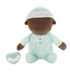 Stuffed toy baby doll with brown skin, wearing a light blue outfit with white patterns on a white background.