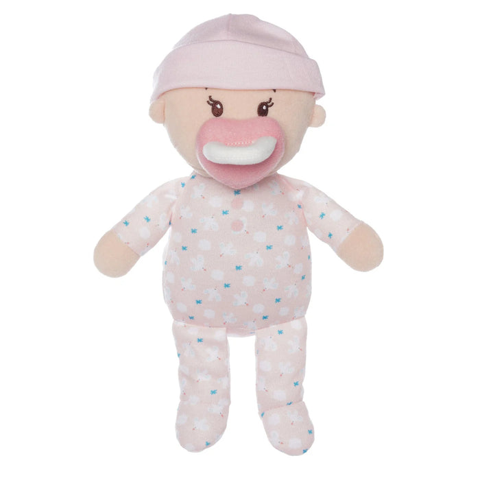 Stuffed baby doll with pink pacifier and hat on a white background
