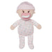Stuffed baby doll with pink pacifier and hat on a white background