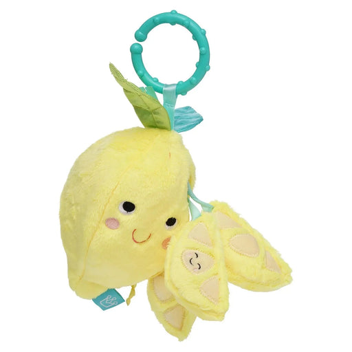 Yellow plush lemon toy with a smiley face and leaf on a white background