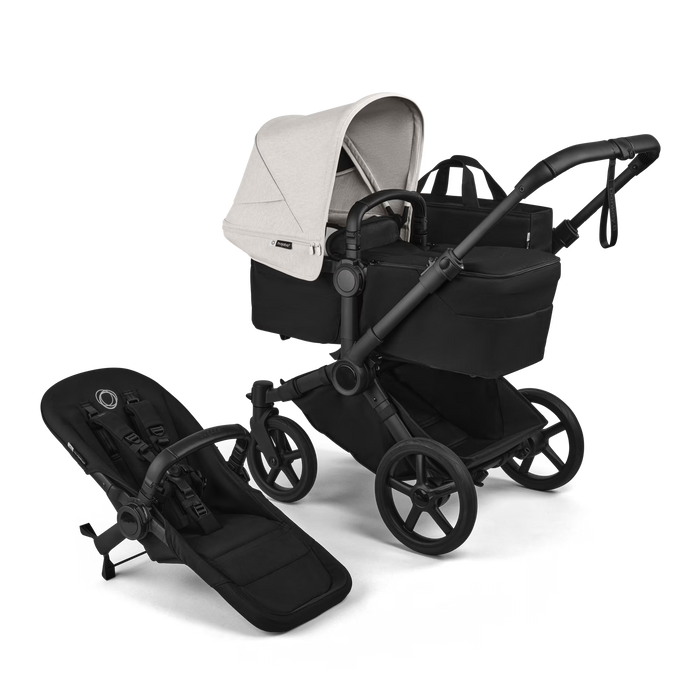 Black and white stroller with attached baby seat on a transparent background