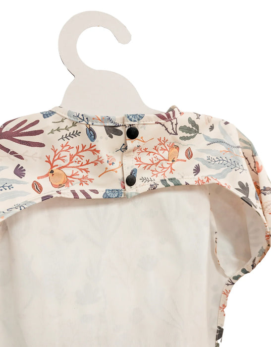 Floral-patterned baby romper on a hanger against a white background