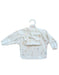 Baby bib with long sleeves and pocket on a white background