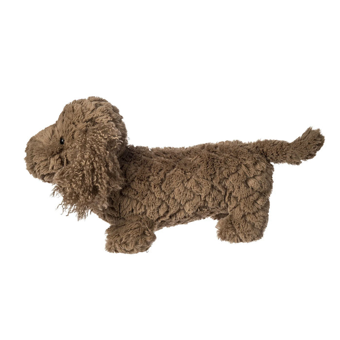 Brown plush dachshund dog toy on a white background