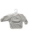 Baby bib with long sleeves and a pocket on a white background