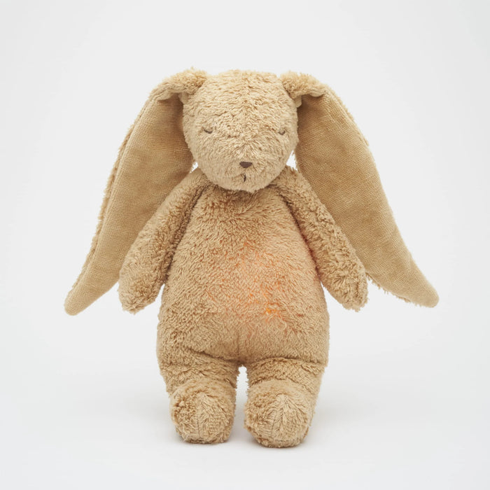 Organic cotton bunny with soft light in belly from internal light and white noise machine on white background