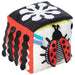 Colorful cube toy with ladybug design on a white background