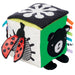 Colorful baby cube with animal and ladybug designs on a white background