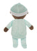 Stuffed toy baby in a green outfit with a white hat on a white background