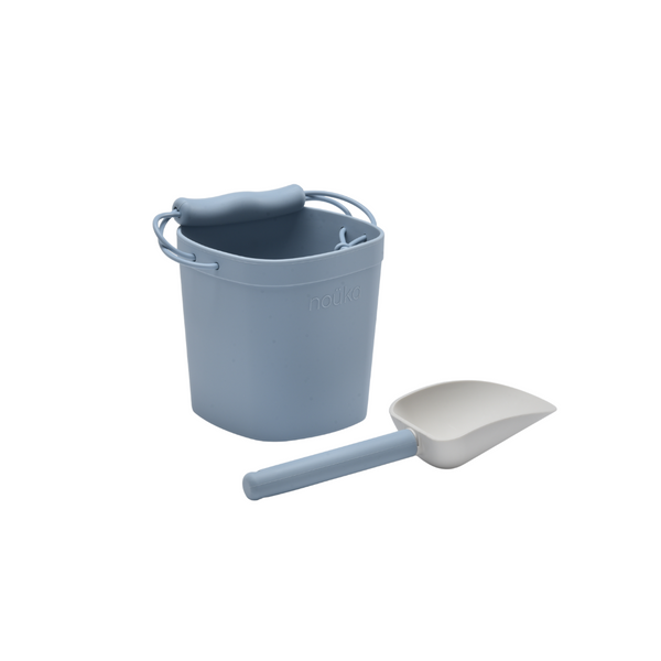 Blue bucket and spade set on a white background
