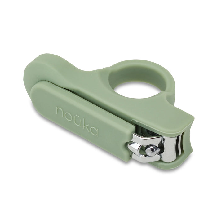 A pair of baby nail clippers with a green safety grip and easy-grip ring handle.