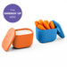 Two containers, one orange and one blue, with carrots and dip respectively on a white background.