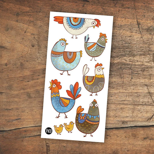 Sheet of colorful chicken illustrations on a wooden surface