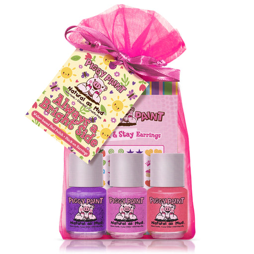 Piggy Paint pink and purple nail polish set with pink drawstring bag on a white background