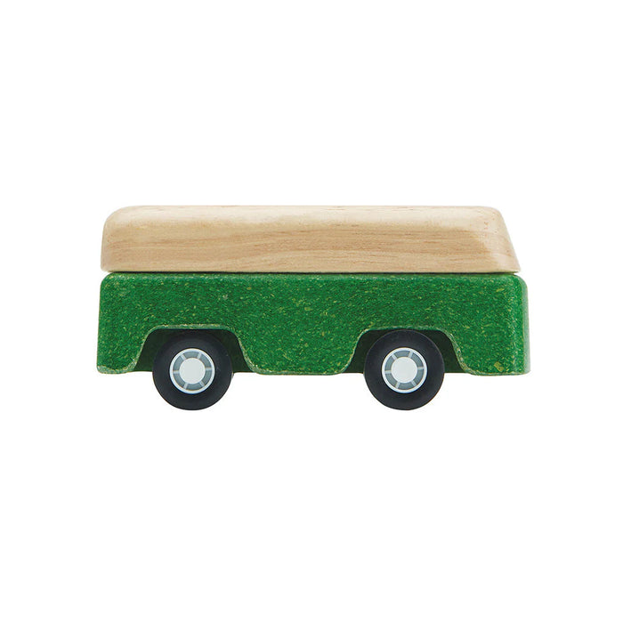 Small green toy truck with a wooden bed on a white background