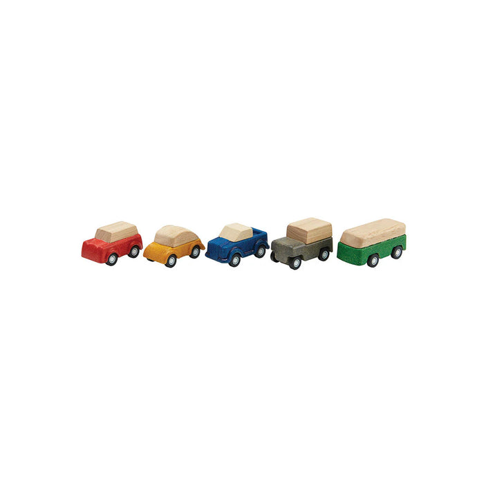 Set of five wooden toy cars lined up on white background