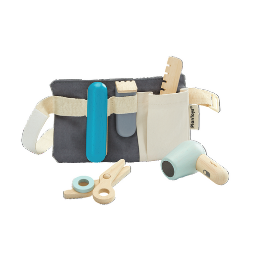 Toy tool belt with various tools on a white background