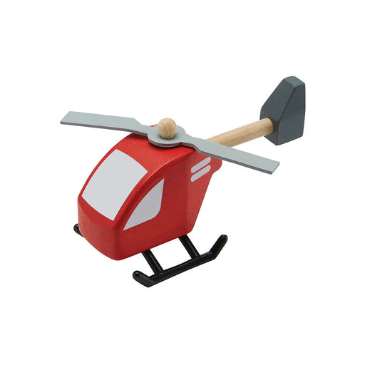 A red wooden toy helicopter on white background