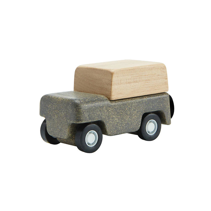 Grey wooden toy vehicle on white background