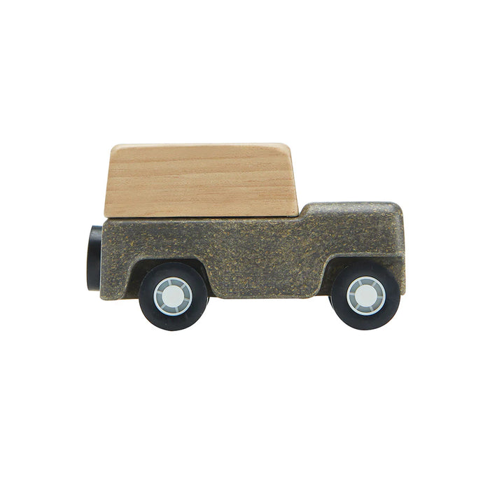 Toy truck with a wooden hood on a white background