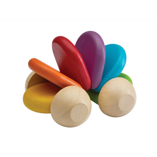 Colorful wooden toy with multicolored shapes on a white background