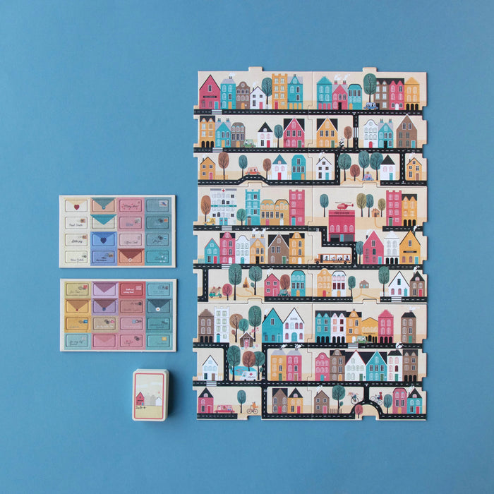 Set of colorful house-themed cards on a blue background