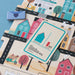 Children's toy with house cards and a blue envelope on a colorful street layout