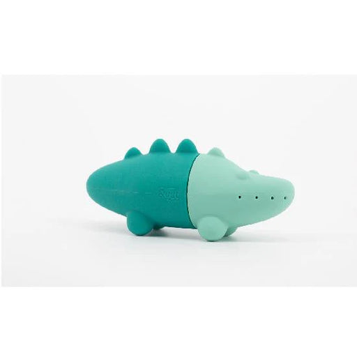 Teal and light green crocodile shaped toy on a white background