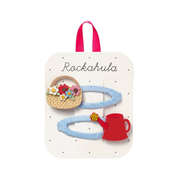 Set of hair clips on a 'Rockahula' branded card with a pink handle.