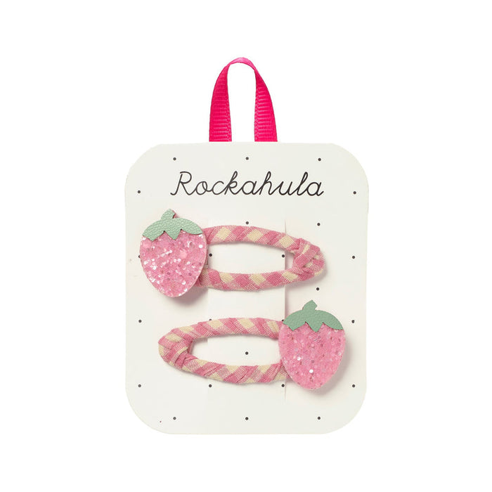 Set of pink strawberry-themed hair clips on a Rockahula branded card.