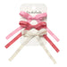 Set of pink and white hair bows on a Rockahula branded card.