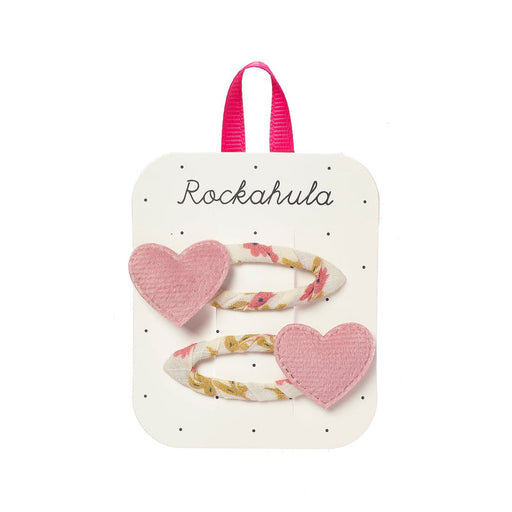 Heart-shaped hair clips on a Rockahula branded card with pink hair ties.