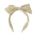 Floral patterned headband with a bow on a white background